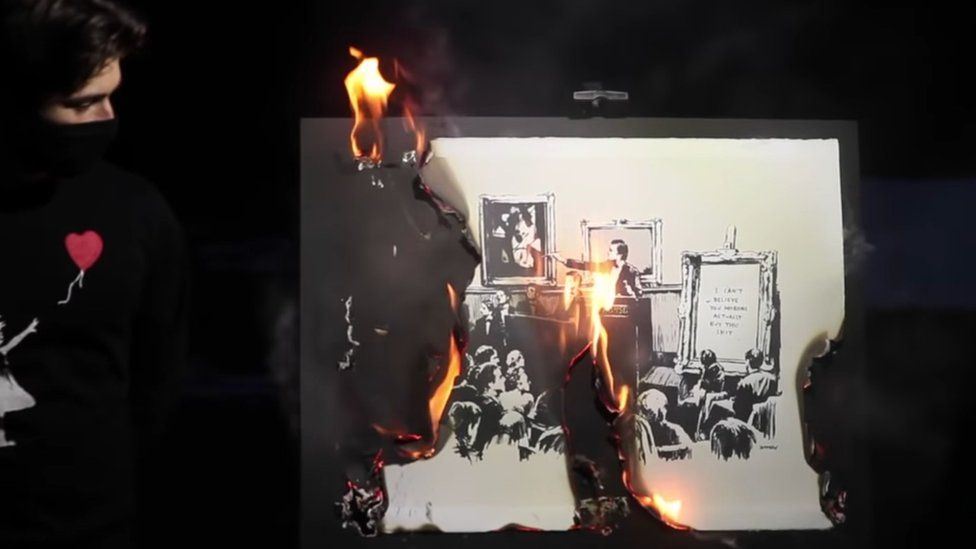 Screenshot from video of Banksy art being burnt