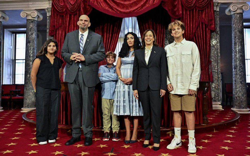 Senator John Fetterman with his wife Gisele (third from right), his children Karl, Grace and August, and Vice-President Kamala Harris