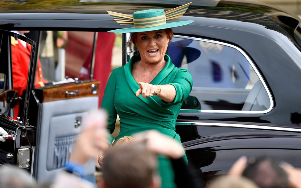 The Duchess of York points at a friend