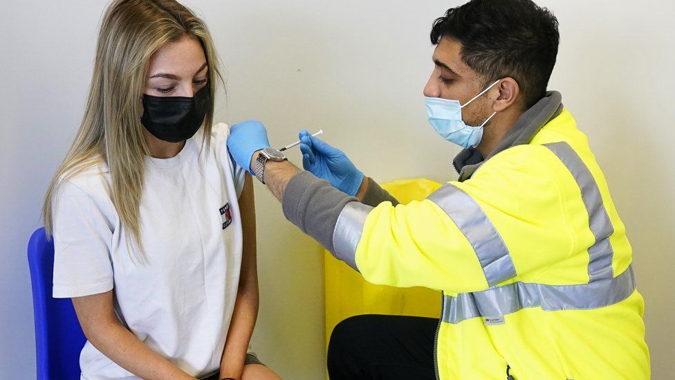 Young person being vaccinated