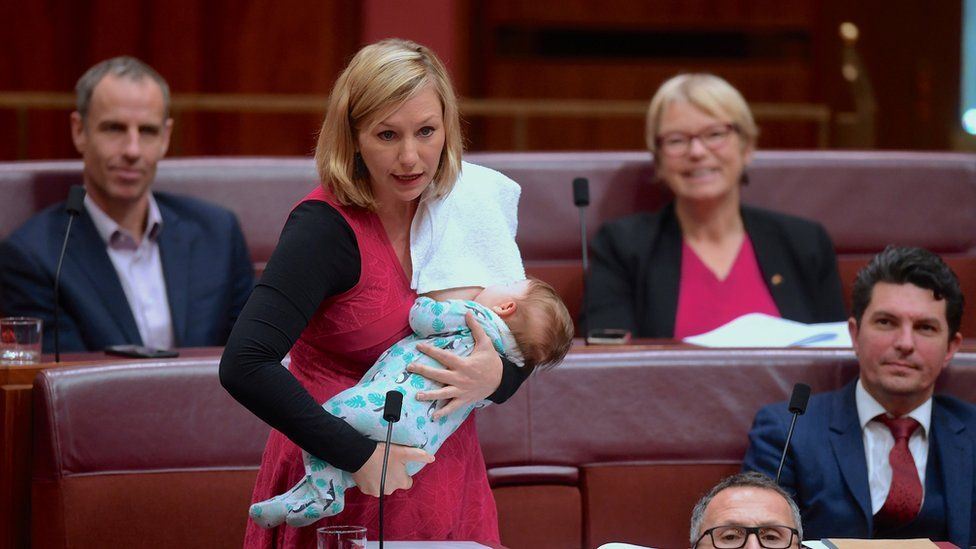 Australian Senator Larissa Waters of the Greens Party breastfeeds her daughter in the Australian Senate in Canberra, Australia.