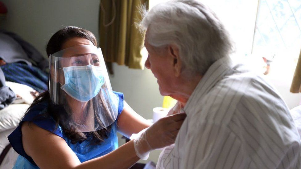 Picture of an elderly patient being looked after