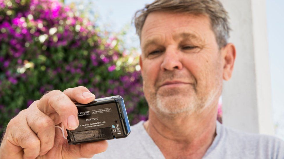 A man with diabetes reading his insulin levels