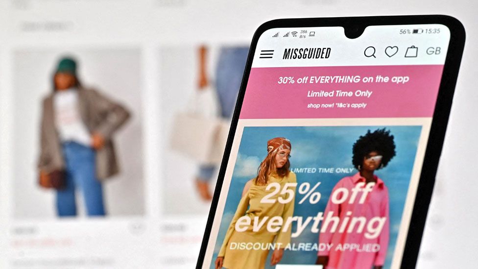 An illustration with a laptop and mobile phone shows the website of online fashion retailer Missguided