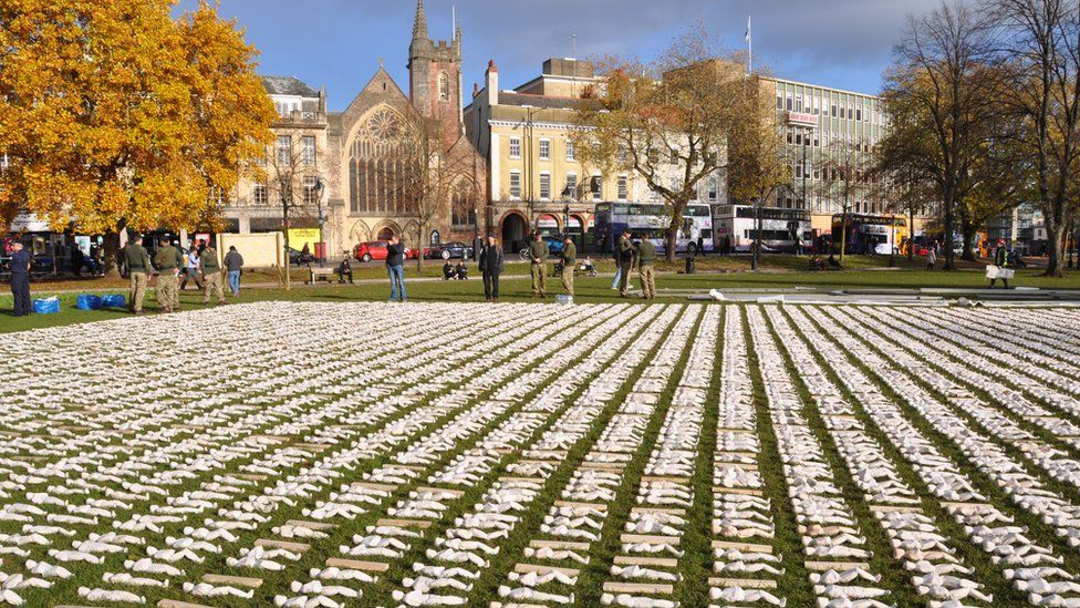 Shrouded figures on College Green