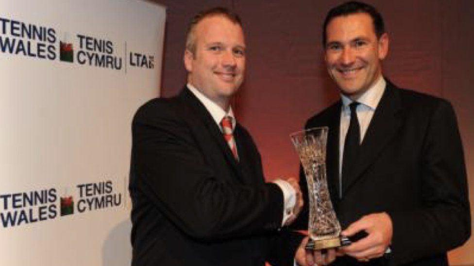 Sanders (left) collecting his award from then LTA chief executive Roger Draper
