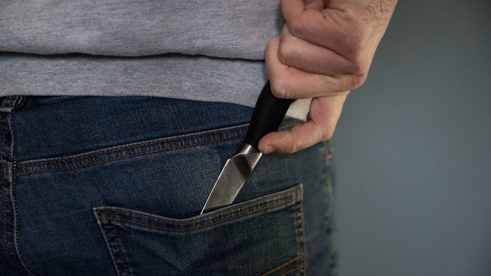 Generic picture of a man carrying a knife