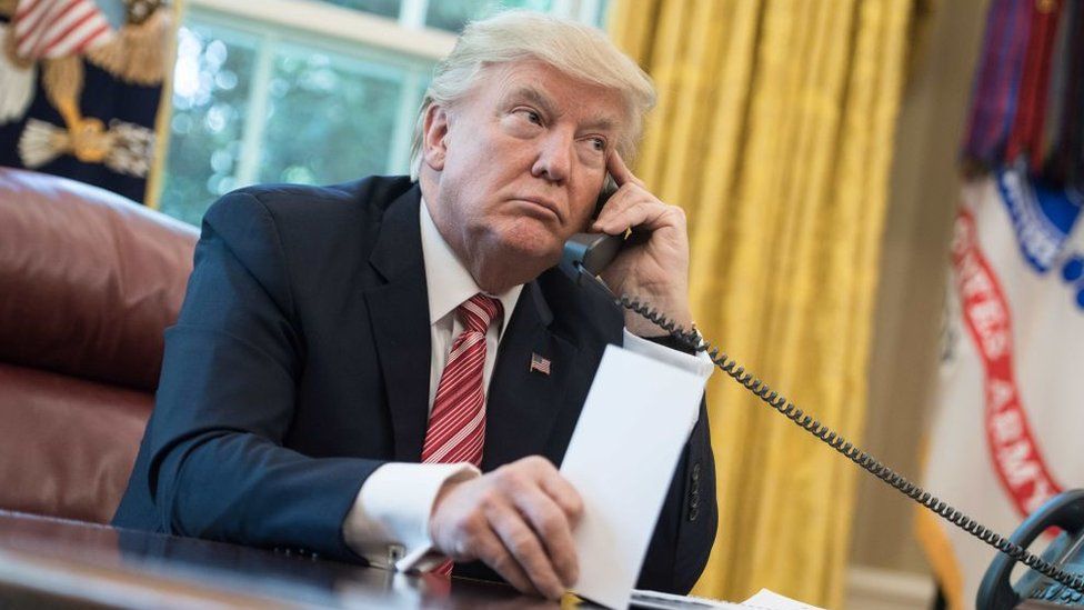 US President Donald Trump waits to speak on the phone with Irish Prime Minister Leo Varadkar in June in Wasington, DC.