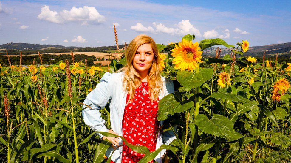 Portia Jones in a field of sunflowers
