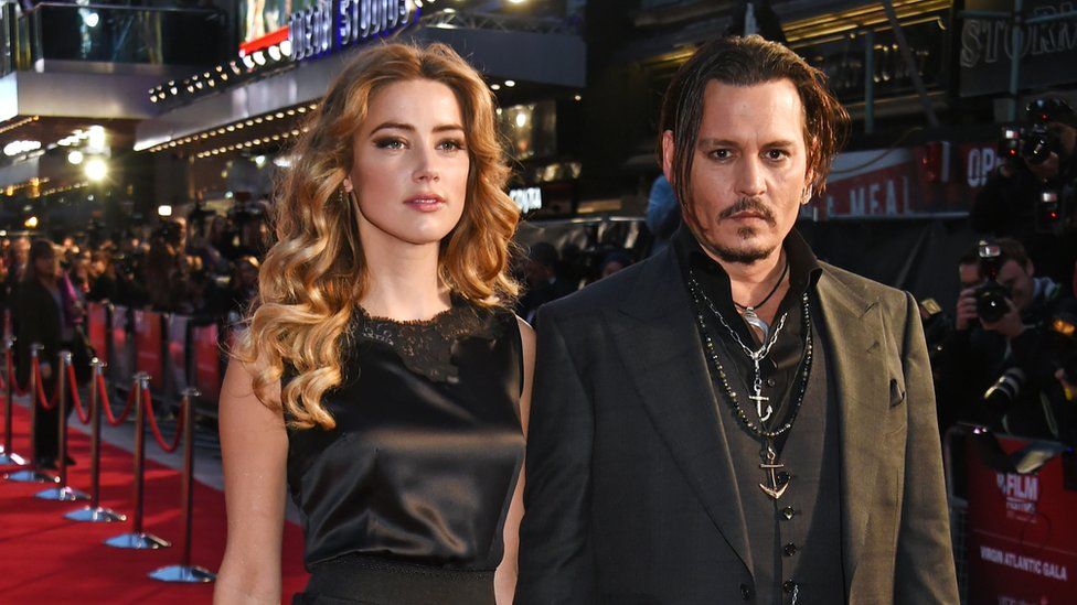 Amber Heard (L) and Johnny Depp attend the Virgin Atlantic gala screening of "Black Mass" during the BFI London Film Festival