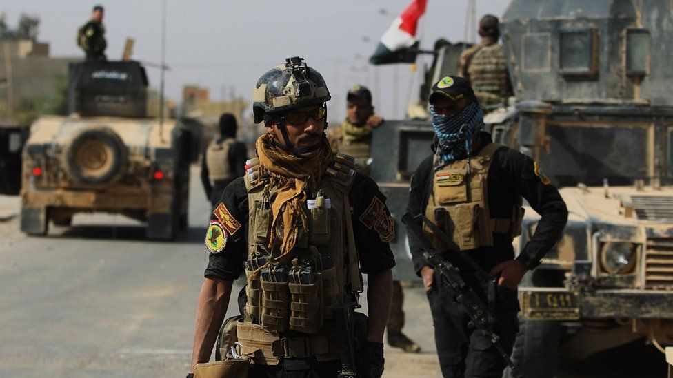 Iraqi forces are seen on 4 November, 2017 in the centre of the city of al-Qaim, in Iraq's western Anbar province after retaking it from Islamic State (IS) group jihadists a day earlier