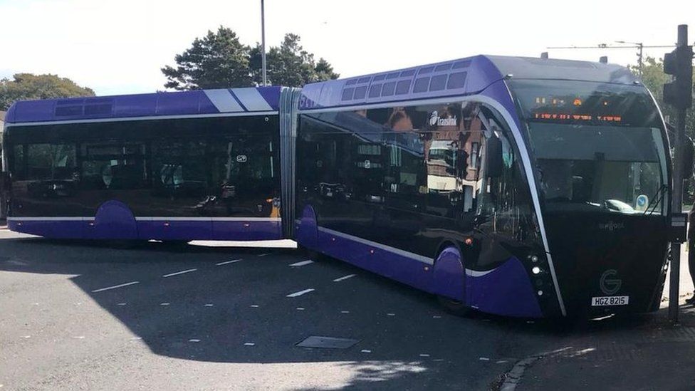 Glider bus gets stuck turning a corner BBC News