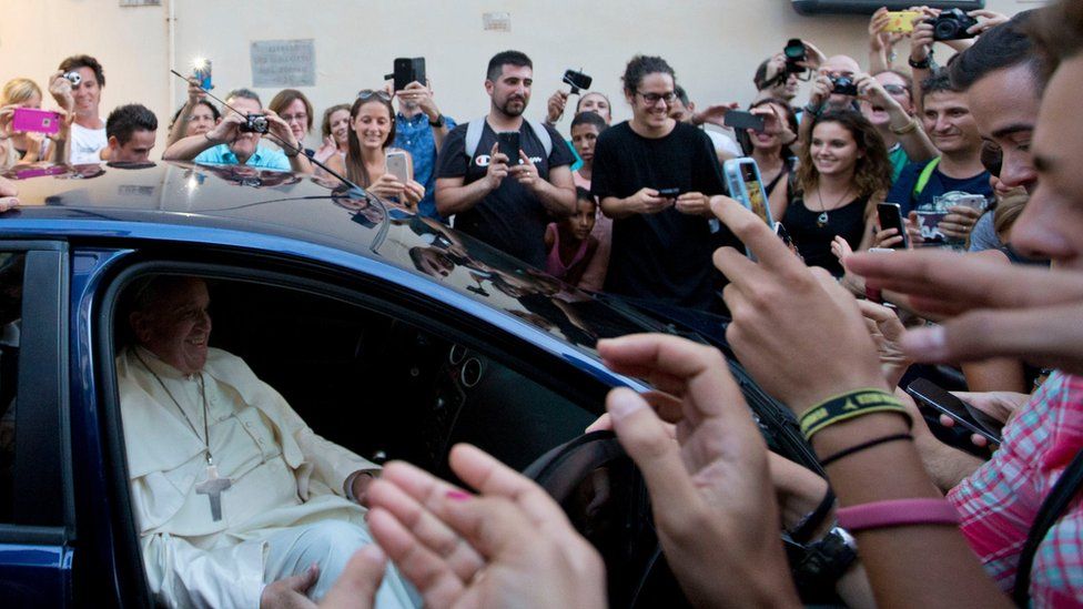 Pope Francis leaves an eyeglass store on Via del Babuino, in central Rome, Thursday, Sept. 3, 2015.