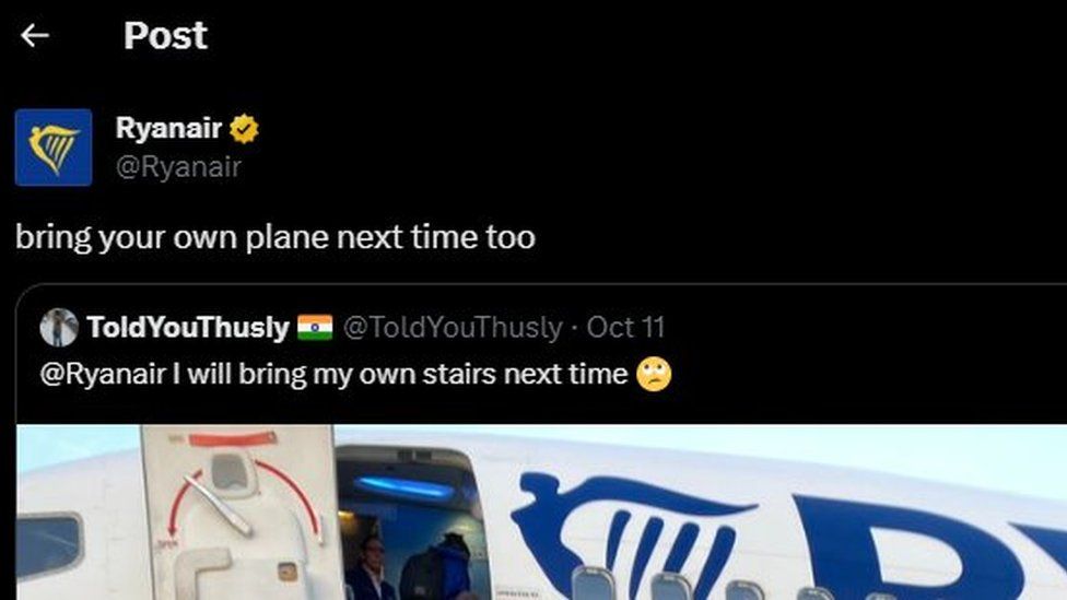 A post from Ryanair's account on X. The text from Ryanair reads "bring your own plane next time too". The post it is responding to is below. It shows a photo of people boarding a plane via a portable staircase. Some passengers are carrying multiple bags. The caption reads "@Ryanair I will bring my own stairs next time"
