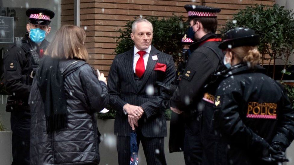 Brian Rose being spoken to by City of London police