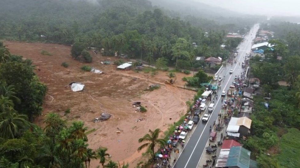 Aerial view of a massive mudslide engulfing homes and trees in a village near Baybay city affected by tropical storm Megi