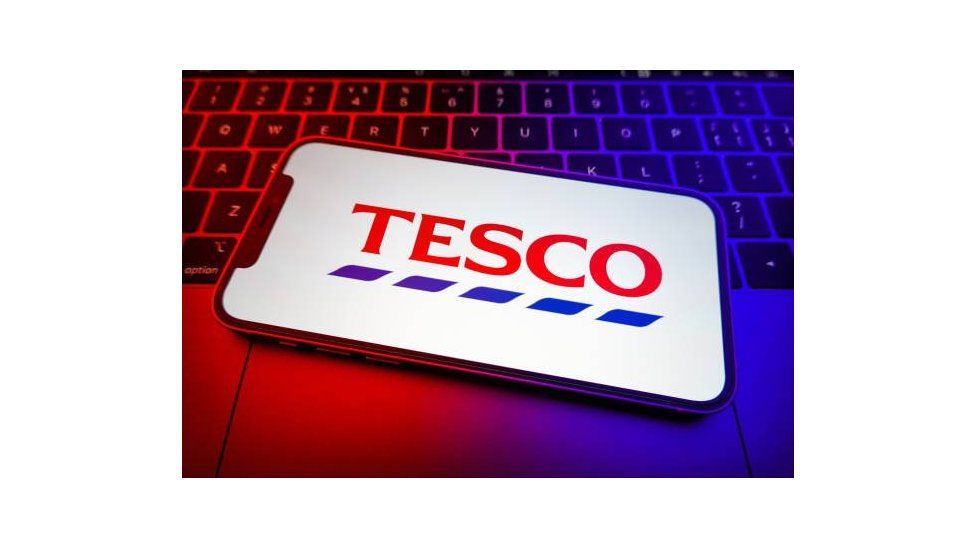 The Tesco logo on smartphone's screen