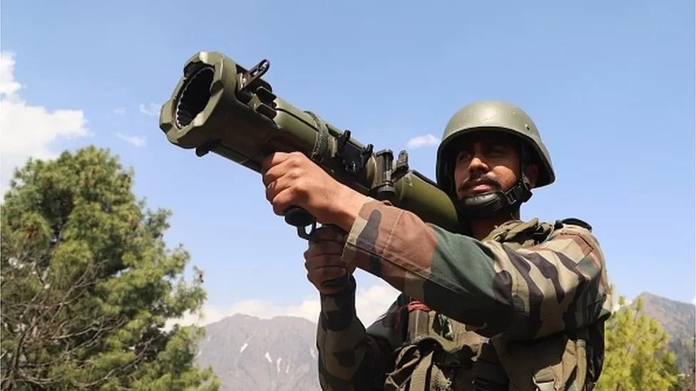 An Indian soldier on the de-facto India-Pakistan border - a 2021 truce has kept things under control