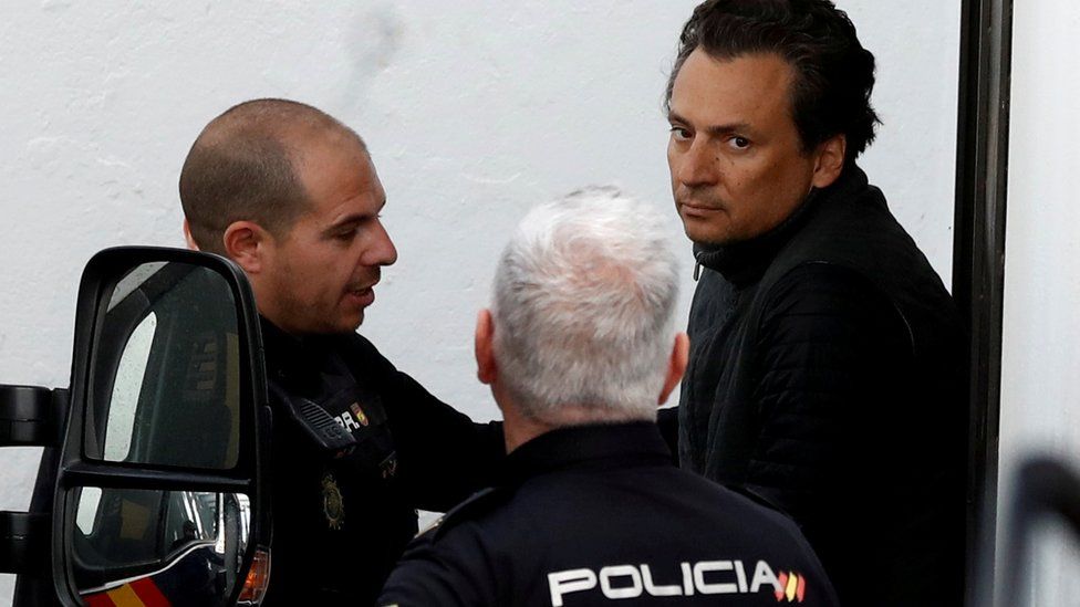 Former chief executive of Mexico's state oil firm Pemex, Emilio Lozoya, is escorted by Spanish police officers as he leaves a court in Marbella, Spain, 13 February 2020