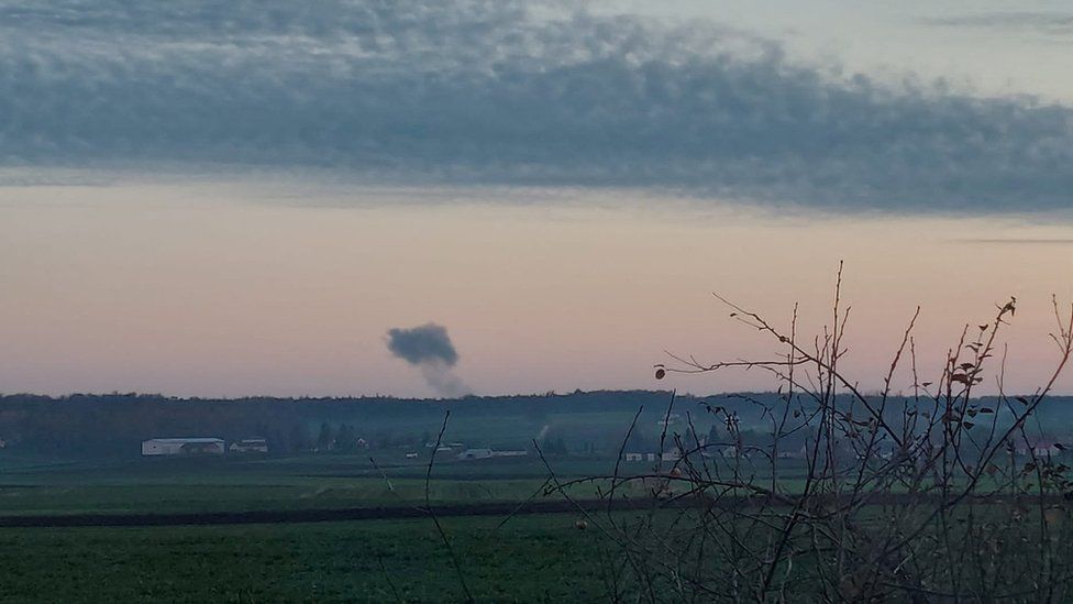 Smoke rises in the distance, amid reports of two explosions, seen from Nowosiolki, Poland, near the border with Ukraine November