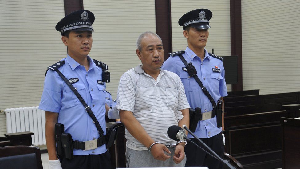 Gao Chengyong attends a trial at the Intermediate People"s Court in Baiyin