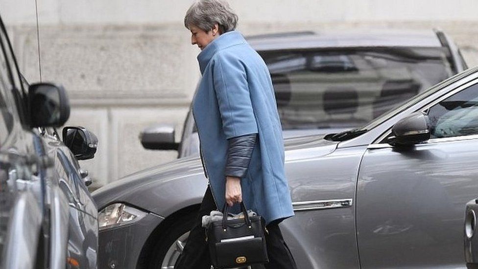 Theresa May arriving in Downing Street