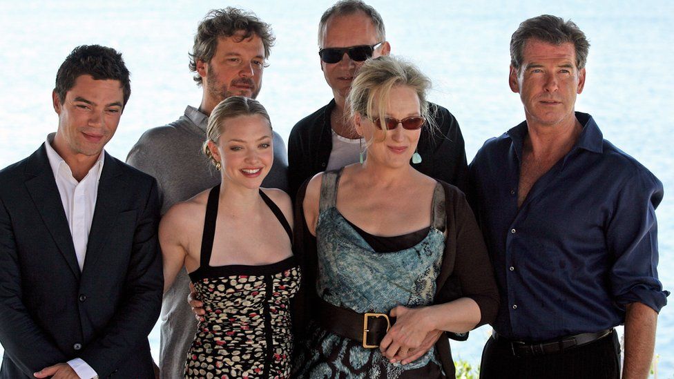 British actor Dominic Cooper, British actor Colin Firth, US actress Amanda Seyfried, Swedish actor Stellan Skarsgard, US actress Meryl Streep and Irish actor Pierce Brosnan pose during a photo opportunity for the promotion of the new movie 'Mamma Mia' at the Lagonissi Grand Resort, some 40 kms south of Athens on June 28, 2008