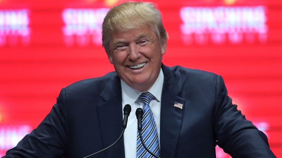 Donald Trump smiles during a speech in Florida.