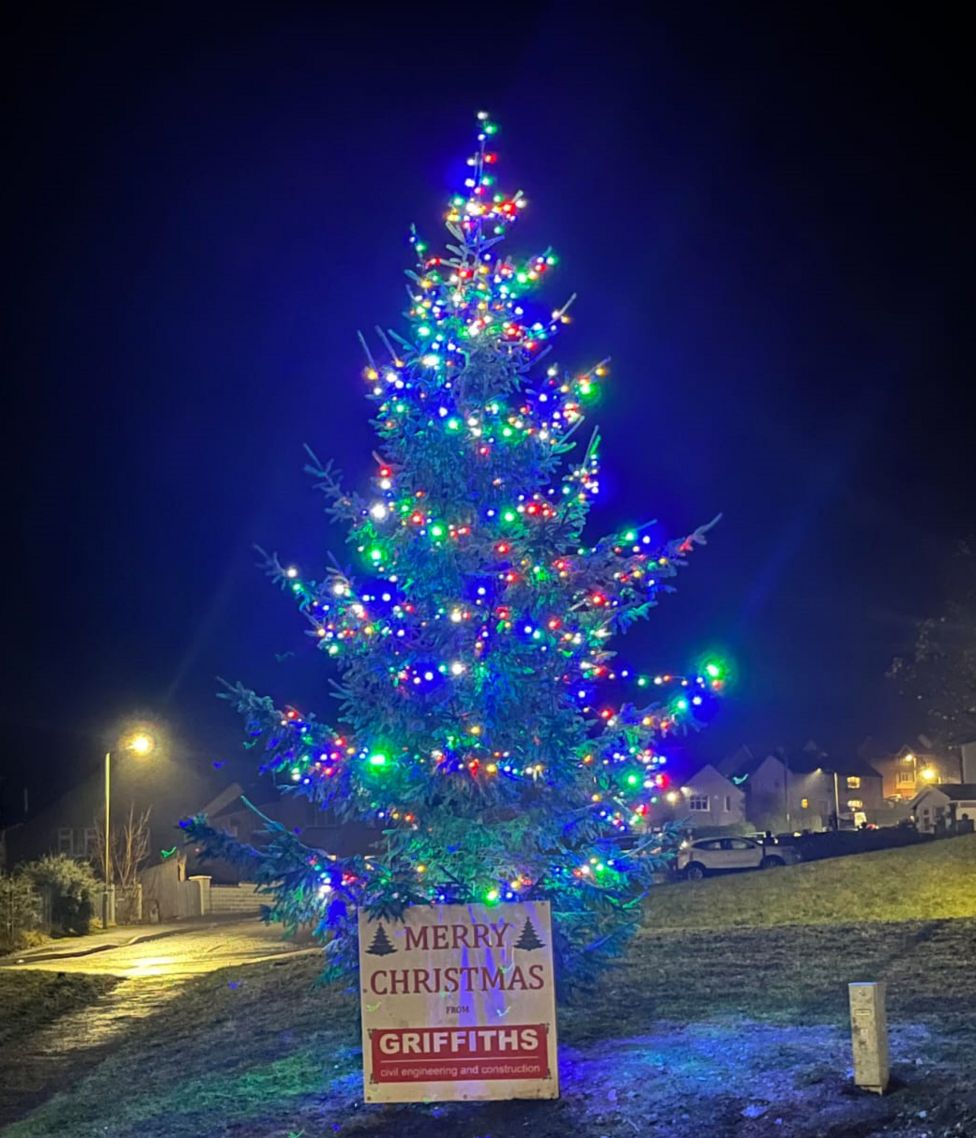 Trefechan Christmas tree lights up again after theft BBC News