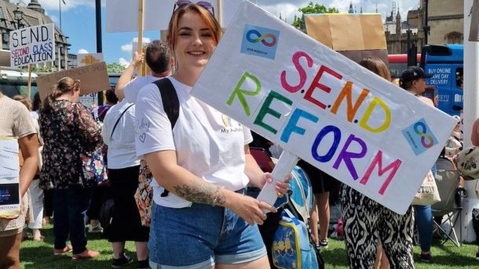 Lisa-Marie Reid holds a placard calling for SEND reform