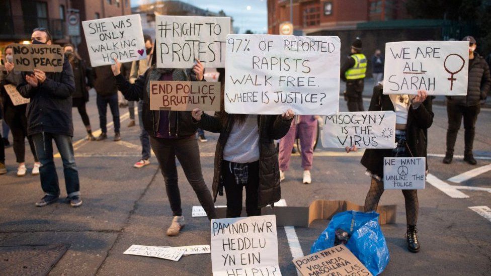 Protestors held signs calling for changes following the death of Sarah Everard