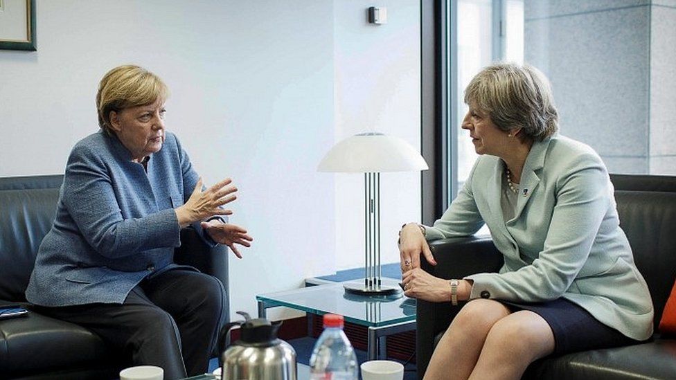 Angela Merkel (left) and Theresa May