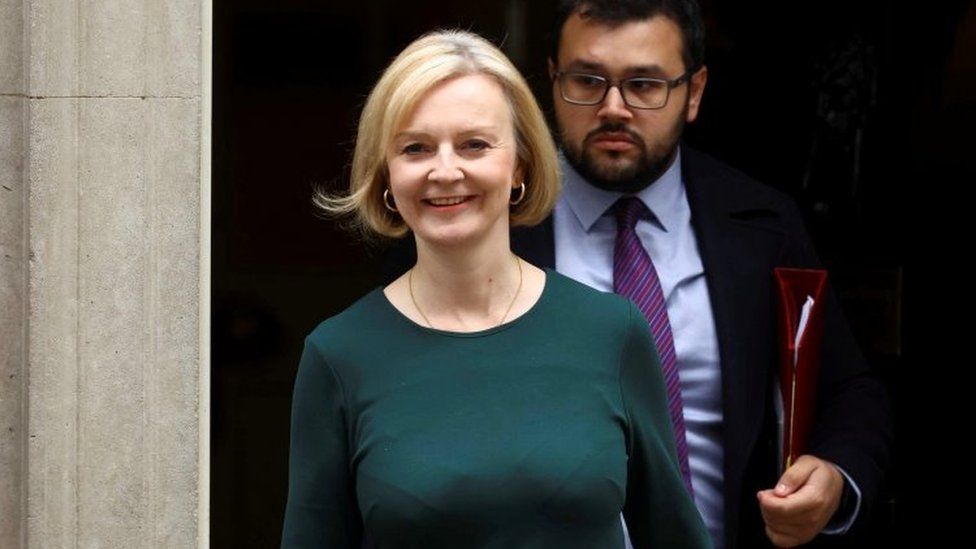 Prime Minister Liz Truss walks outside Number 10 Downing Street