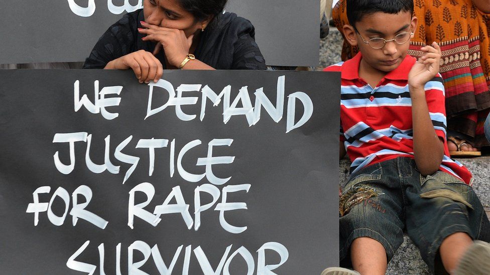 Activists from various women's rights organisation and children stage a silent demonstration against sexual assault and rapes on women, in Bangalore on April 22, 2015.