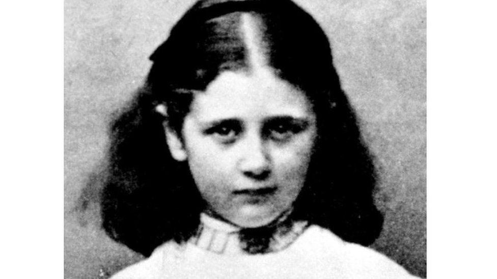 A black and white photograph of a young Beatrix Potter, aged nine