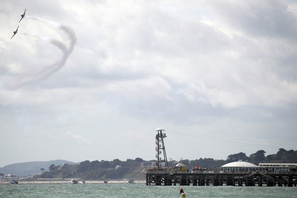 The Strikemaster pair perform for the crowds on day one of the Bournemouth Air Festival
