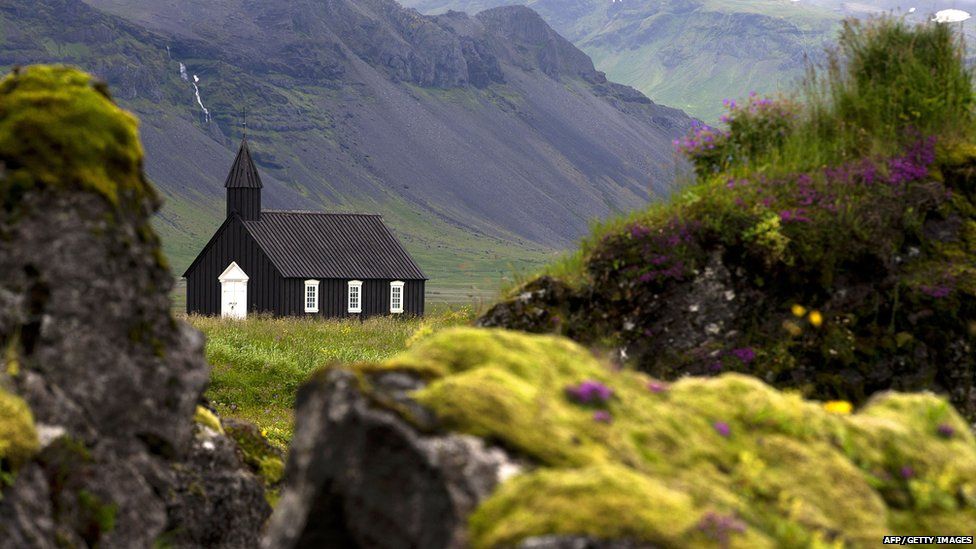 This picture taken on July 11, 2014 shows the old church of Budir, a small hamlet in lava fields in the Snaefellsnes peninsula, western Iceland.