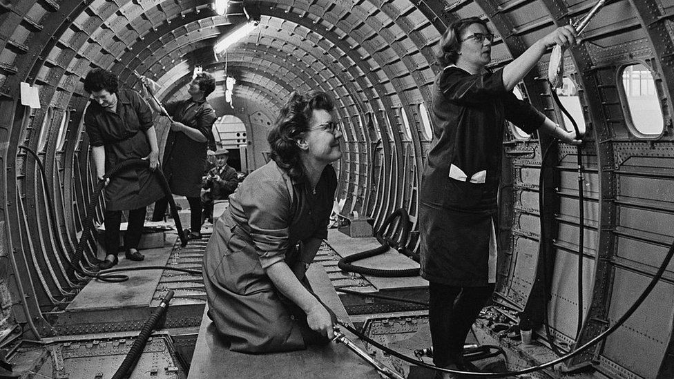 Cleaners inside Concorde