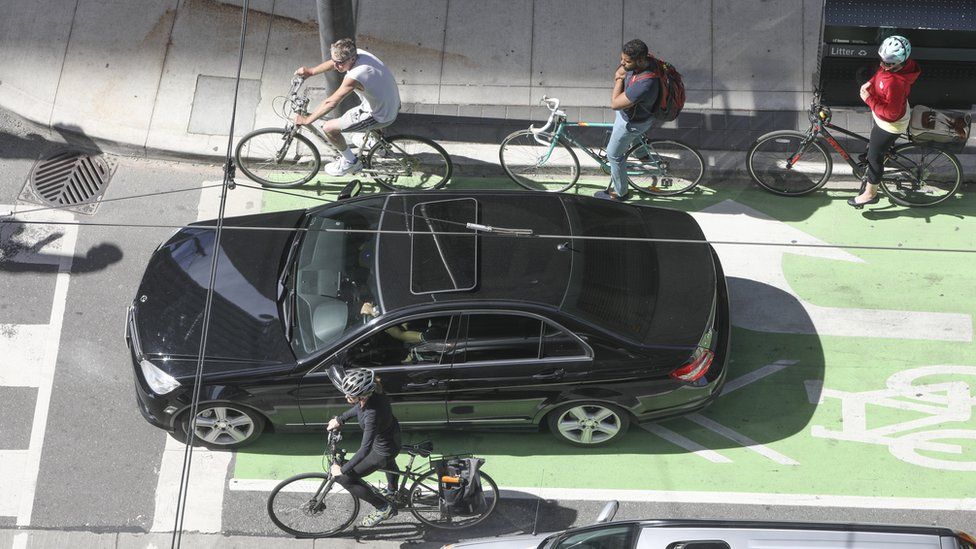 A Toronto intersection with cars and bicycles