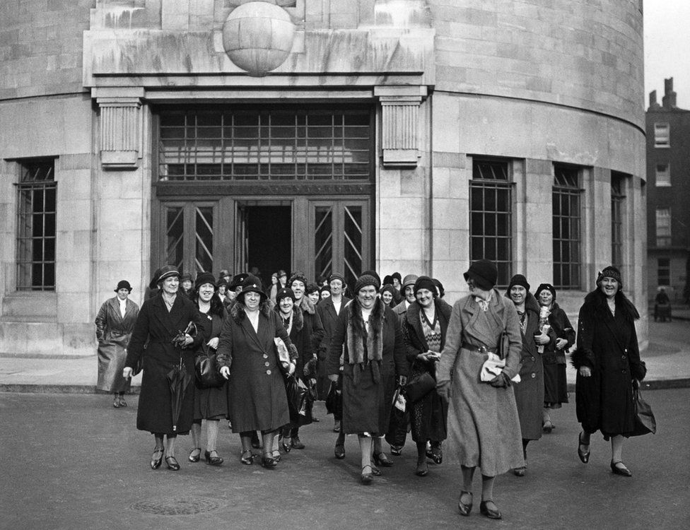 Cleaners leaving the BBC, October 1932