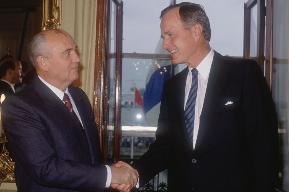 Shaking hands in Helsinki with Soviet President Mikhail Gorbachev