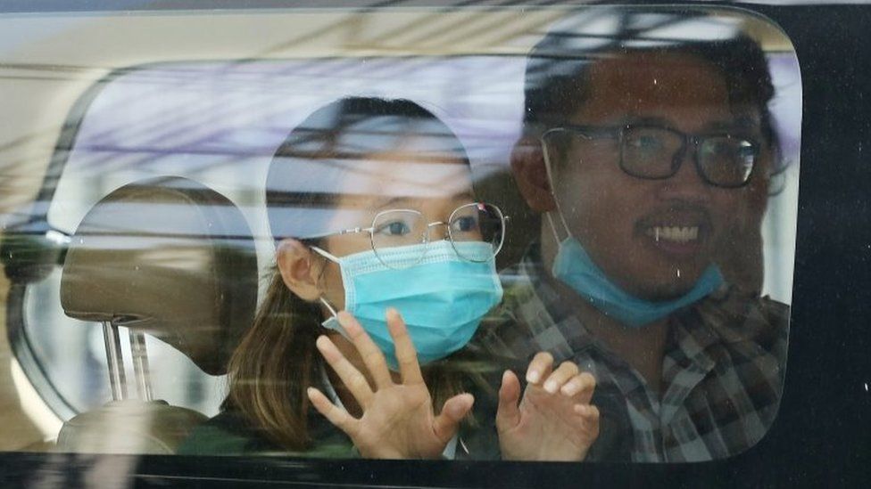 A handout photo made available on 22 June 2021 by Cambodian Human Rights Organization LICADHO shows environmental activist Sun Ratha (L) sitting in a police van near the Municipal Court in Phnom Penh, Cambodia, 19 June 2021 (issued 22 June 2021).