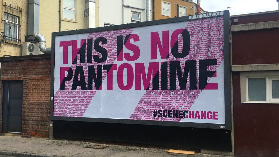 A billboard reading: This is no pantomime
