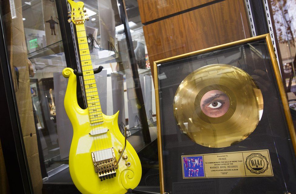Yellow guitar used by musician Prince sits on display before its auction in Beverly Hills, California. 22 June 2016