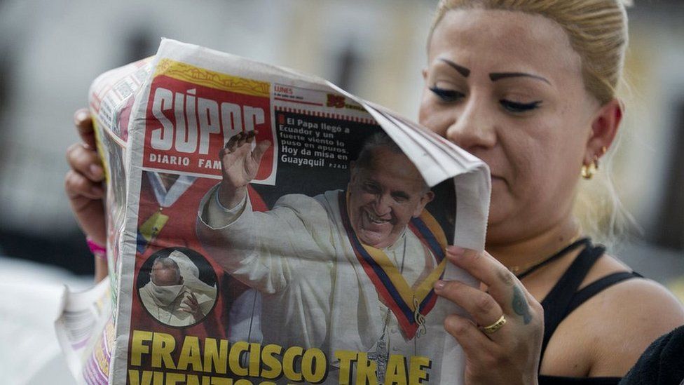 Woman reading newspaper in Ecuador