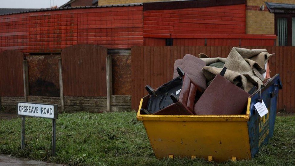 A skip full of property from a flooded house