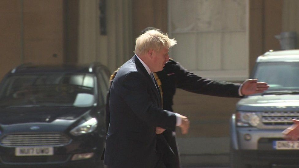Boris Johnson arrives at the Palace