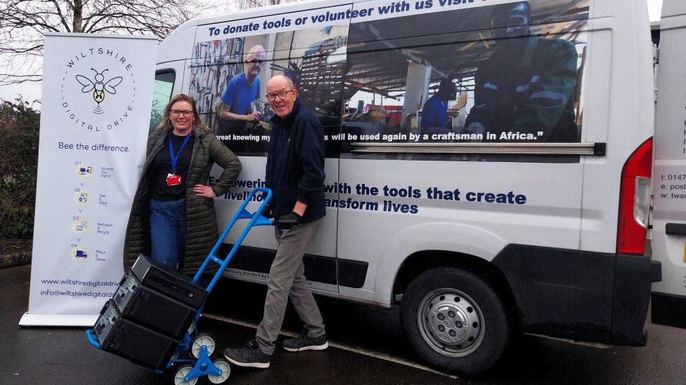 Natalie Luckham, CEO of Wiltshire Digital Drive, with TWAM volunteer driver, Neil in front of a van