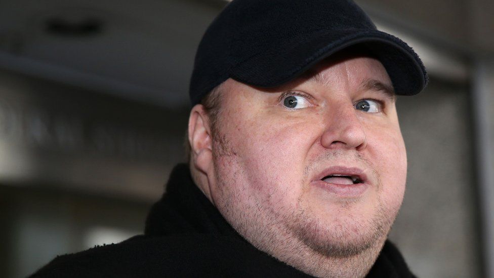 In this file photo taken on December 22, 2015, Internet mogul Kim Dotcom leaves an Auckland court after a judge ruled that he and three other defendants are eligible for extradition to the US