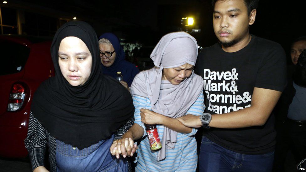 The mother of a missing Trigana Air plane crew member at the Trigana Air office, in Jakarta, Indonesia on 16 August 2015